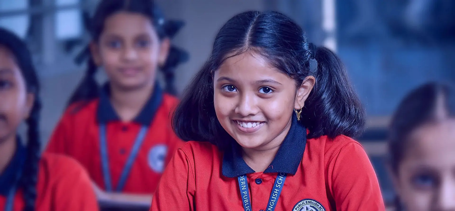 Young child engaged in creative art activity with teacher